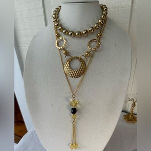 Three goldtone layering style necklaces